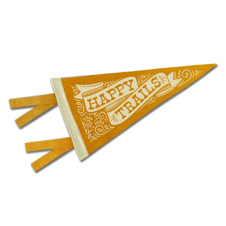 Yellow and white pennant with a bandana design in the background and a white banner design in center. Yellow text saying, “Happy Trails”.