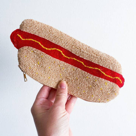Beaded pouch with zipper in the image of a hot dog in a bun with mustard on top.
