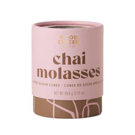 Light pink circle container with brown text saying, “Good Citizen Chai Molasses Sugar Cubes”. pink swirl design on bottom of container.