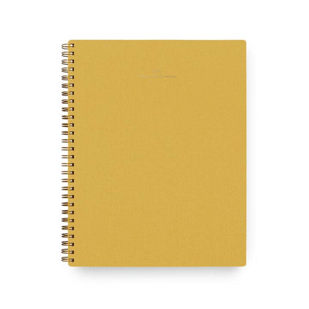 Yellow mustard cover with gold metal coil binding on left side. Gold foil text in center saying, “2025 Task Planner”.