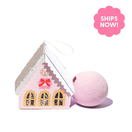 Pink soap balls wrapped in a box in the image of a village pink house.