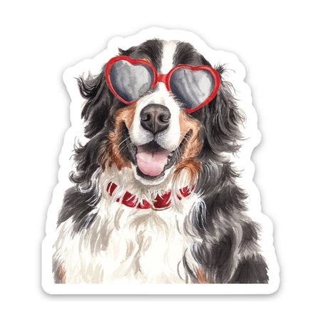 Sticker in the image of a brown, black and white Bernese Mountain dog wearing a red collar and red heart sunglasses.