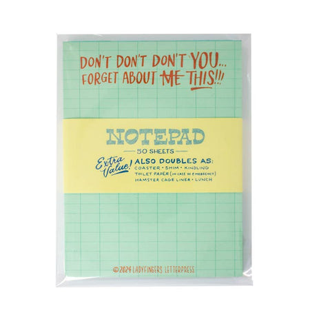 Green notepad with graph design with red text saying, “Don’t Don’t Don’t You…Forget About Me This!!” with the word “ME” crossed out.