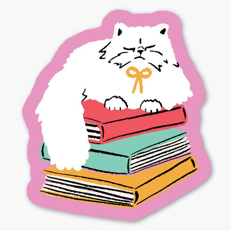 Pink sticker with image of a white cat sitting on top of a pile of books.