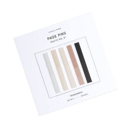 Rectangele sticky notes in gray, ivory, tan and black shades presented on a ivory background.