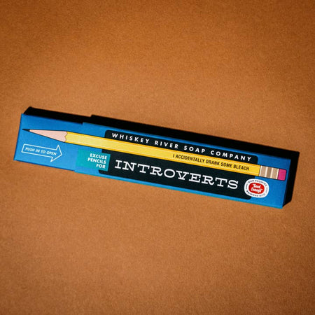 Blue box with black label. White text saying, “Excuse Pencils for Introverts”.