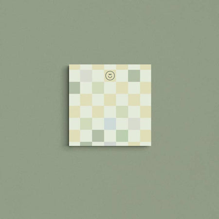 Square pad with dark green, mint green, tan and gray squares in a checkerboard pattern.