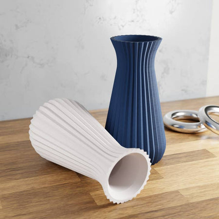 White vase with vertical contoured lines.