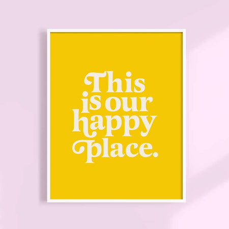 Yellow background with white text saying, “This is Our Happy Place”. 