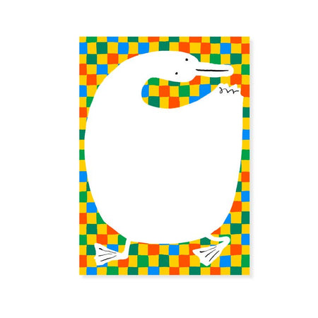 Notepad with yellow, green, blue and red checker pattern in background. Large white duck in foreground.