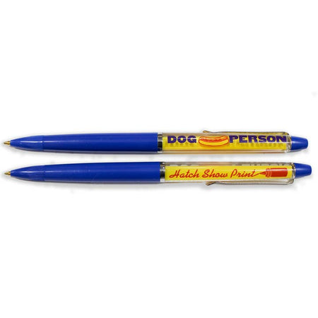 Blue and yellow pen with blue text saying, “Dog Person” with image of a hot dog in a bun.