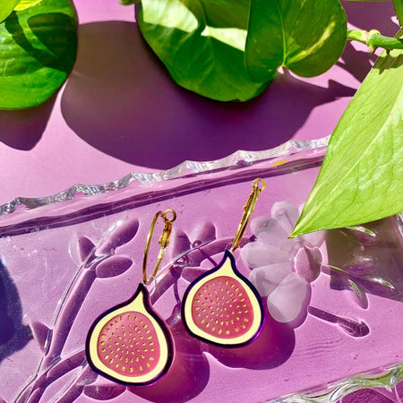 Set of earrings in the image of fig fruits.