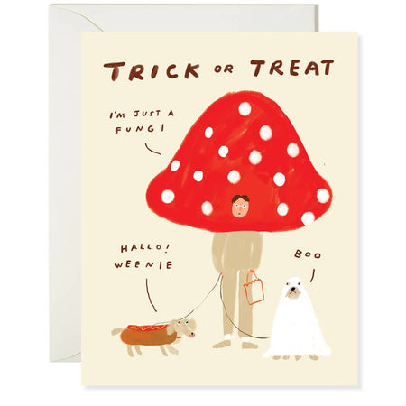 Tan card with brown text saying, “Trick or Treat; I’m Just a Fungi; Hallo! Weenie; Boo”. Images of a man dressed as a mushroom; a dog dressed as a hot dog; and another dog dressed as a ghost. A white envelope is included.