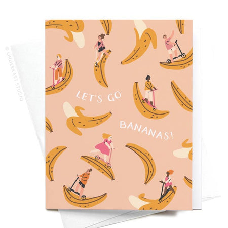 Pink card with white text saying, “Let’s Go Bananas!” Images of people riding on yellow bananas scattered across card.  A white envelope is included.