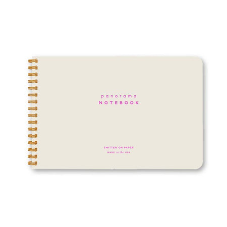 Horizontal rectangle notebook in light blue color with pink foil text saying, 