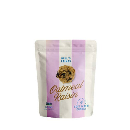 Oatmeal Raisin cookies packaged in a zip seal bag with purple and white vertical stripes with blue and gold text saying, “Bell’s Reines Oatmeal Raisin”.