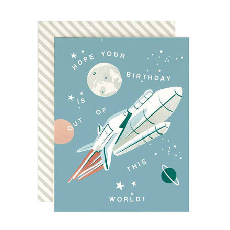 Blue card with image of a white rocket ship. various planets and white stars. White text saying, 