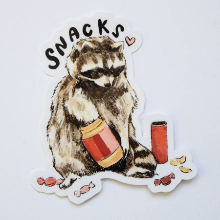 Image of a raccoon digging through a jar of peanut butter and a candy jar. Black text saying, “Snacks”.