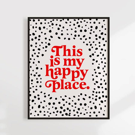 White background with black polka-dots with red text saying, “This is My Happy Place”. 