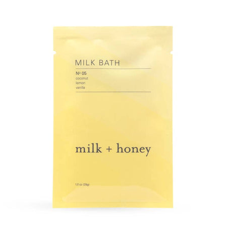 Yellow envelope with black text saying, “Milk Bath No 5 Coconut Lemon Vanilla Milk + Honey”.