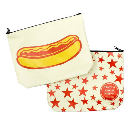 White canvas pouch with black zipper on top. Image of a hot dog in a bun on front side and scattered red stars on back side.