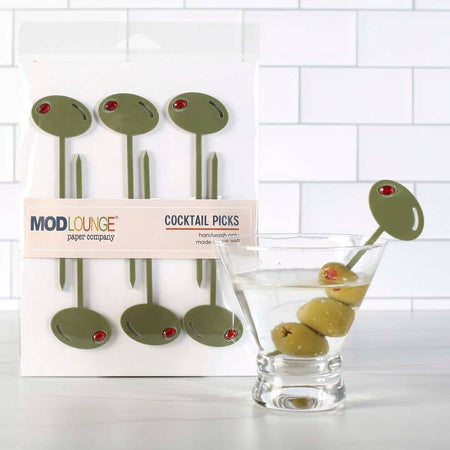 Green cocktail picks in the image of green olives on the top and straight pointed pick on the bottom.