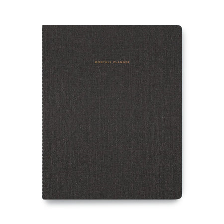 Charcoal gray cover with gold foil text saying, “Monthly Planner” in top center.