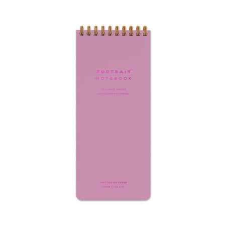 Vertical rectangle notebook in orchid pink color with pink foil text saying, 