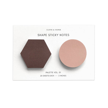 Sticky notes in the shape of a hexagon and a circle in a plum and pink color.