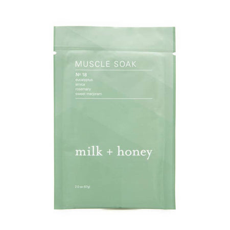 Green envelope with white text saying, “Muscle Soak No 18 Eucalyptus Arnica Milk + Honey”.