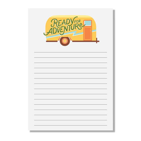 White lined notepad with a yellow vintage camper trailer with green text saying, “Ready for Adventure”.