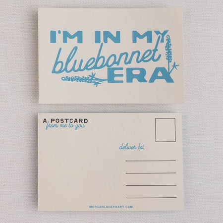 Ivory postcard with images of bluebonnet flowers and blue text saying, “I’m in My Bluebonnet Era”.