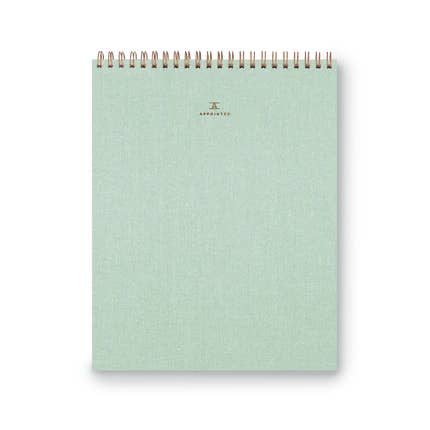 Mint green cover with gold foil text saying, “Appointed”. Gold coil binding across top.