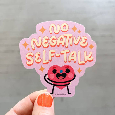 Purple sticker with image if a red heart person giving himself a hug. White text saying, “No Negative Self Talk”.