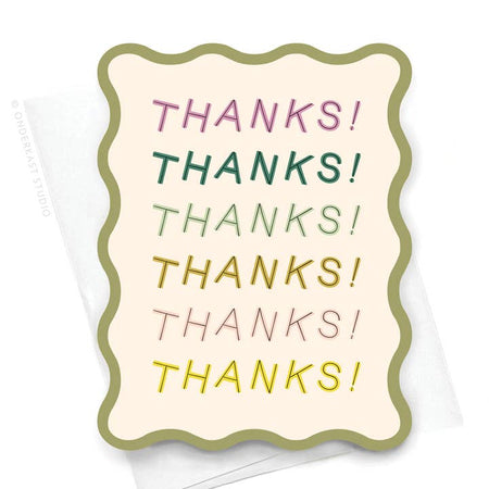 White card with wavy die cut green border. Different color text saying, “Thanks! Thanks! Thanks! Thanks!” layered down the card. A white envelope is included.