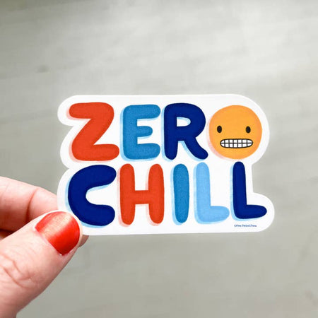 White sticker with rainbow text saying, “Zero Chill” with an image of a smiley face emoji with gritted teeth.