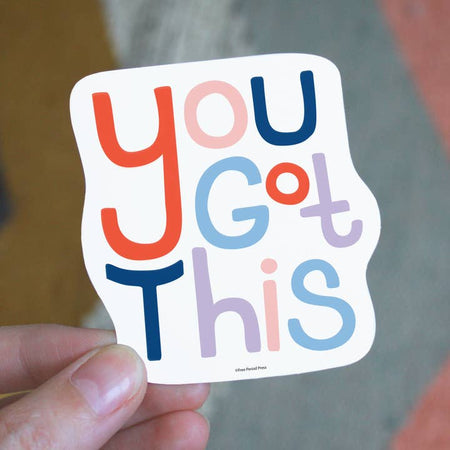 White sticker with rainbow text saying, “You Got This”.