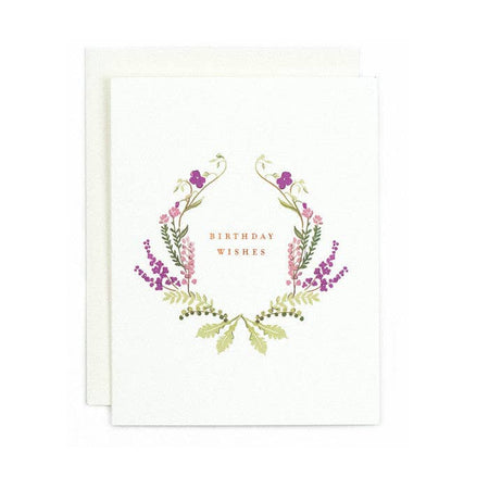 White card with image of a floral border with purple, pink and green flowers. Red text saying, 