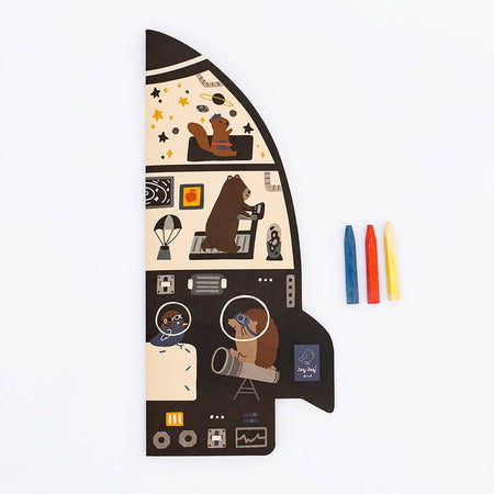 Coloring book shaped in the image of a rocket ship with a tan background and images of different space themes and objects.