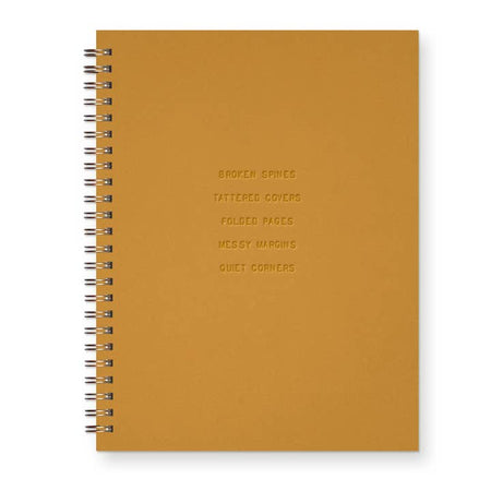 Orange copper cover with embossed text saying, 