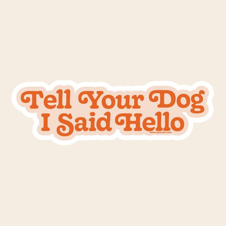 Sticker with pink background and red text saying, “Tell Your Dog I Said Hello”.