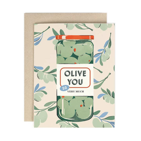 Ivory card with green olive branches in background. Image of an olive jar with red lid and white label. Text on label saying, 