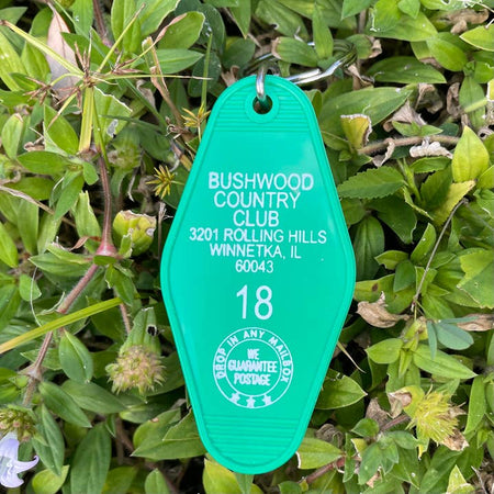 Green vintage style club fob with white text featuring Bushwood Country Club from the Caddyshack movie.