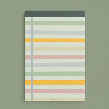 Legal pad with mint green background and dark green, gray, orange, tan and pink horizontal stripes.