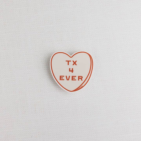 White heart with red border and red text saying, “Texas 4 Ever”.
