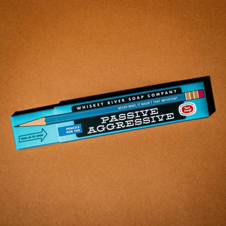 Blue box with black label. White text saying, “Pencils for the Passive Aggressive”.
