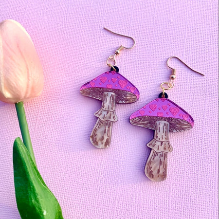Set of earrings in the image of two pink mushrooms.