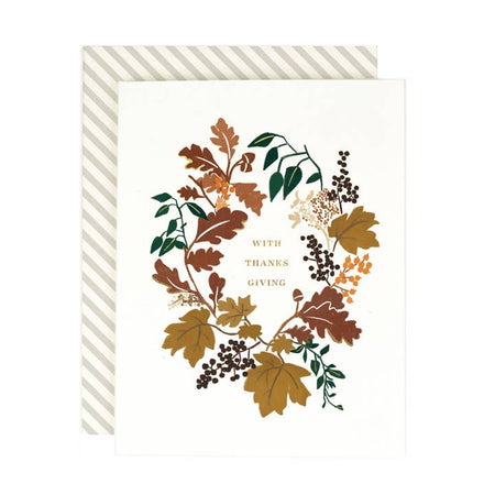 White card fall leaves circular border. Gold foil text saying, 