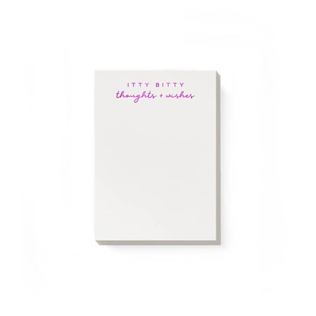 Ivory notepad with hot pink text saying, 