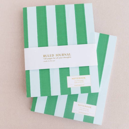 Journal with green and white vertical stripes with binding on left side.